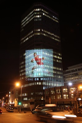 14.10.11 -  Good luck messages are projected onto the side Admiral's offices in Cardiff ahead of Wales' Rugby World Cup Semi Final against France 