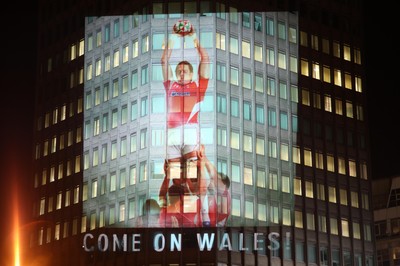 14.10.11 -  Good luck messages are projected onto the side Admiral's offices in Cardiff ahead of Wales' Rugby World Cup Semi Final against France 