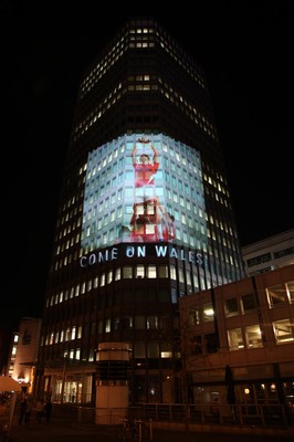 14.10.11 -  Good luck messages are projected onto the side Admiral's offices in Cardiff ahead of Wales' Rugby World Cup Semi Final against France 