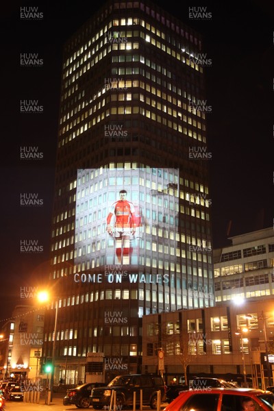 14.10.11 -  Good luck messages are projected onto the side Admiral's offices in Cardiff ahead of Wales' Rugby World Cup Semi Final against France 