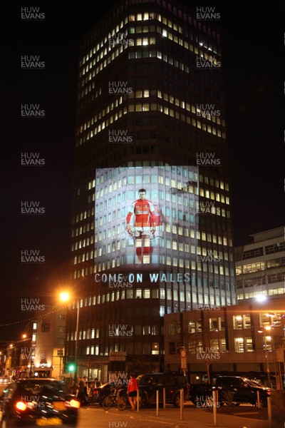 14.10.11 -  Good luck messages are projected onto the side Admiral's offices in Cardiff ahead of Wales' Rugby World Cup Semi Final against France 