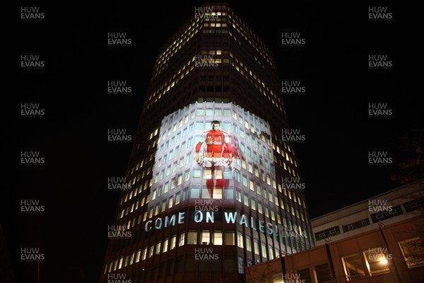 14.10.11 -  Good luck messages are projected onto the side Admiral's offices in Cardiff ahead of Wales' Rugby World Cup Semi Final against France 