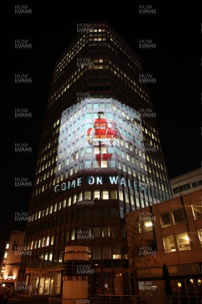 14.10.11 -  Good luck messages are projected onto the side Admiral's offices in Cardiff ahead of Wales' Rugby World Cup Semi Final against France 