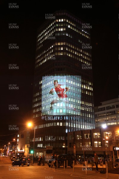 14.10.11 -  Good luck messages are projected onto the side Admiral's offices in Cardiff ahead of Wales' Rugby World Cup Semi Final against France 
