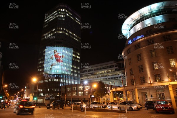 14.10.11 -  Good luck messages are projected onto the side Admiral's offices in Cardiff ahead of Wales' Rugby World Cup Semi Final against France 