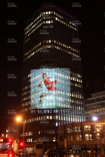 14.10.11 -  Good luck messages are projected onto the side Admiral's offices in Cardiff ahead of Wales' Rugby World Cup Semi Final against France 