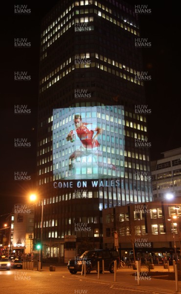 14.10.11 -  Good luck messages are projected onto the side Admiral's offices in Cardiff ahead of Wales' Rugby World Cup Semi Final against France 