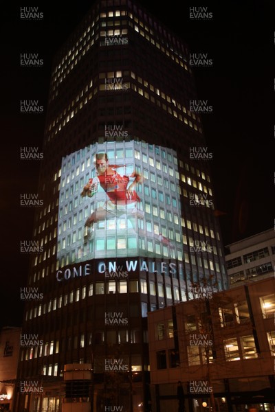 14.10.11 -  Good luck messages are projected onto the side Admiral's offices in Cardiff ahead of Wales' Rugby World Cup Semi Final against France 