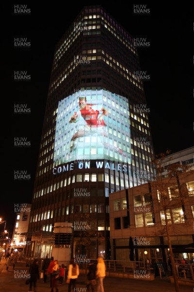 14.10.11 -  Good luck messages are projected onto the side Admiral's offices in Cardiff ahead of Wales' Rugby World Cup Semi Final against France 