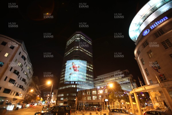 14.10.11 -  Good luck messages are projected onto the side Admiral's offices in Cardiff ahead of Wales' Rugby World Cup Semi Final against France 