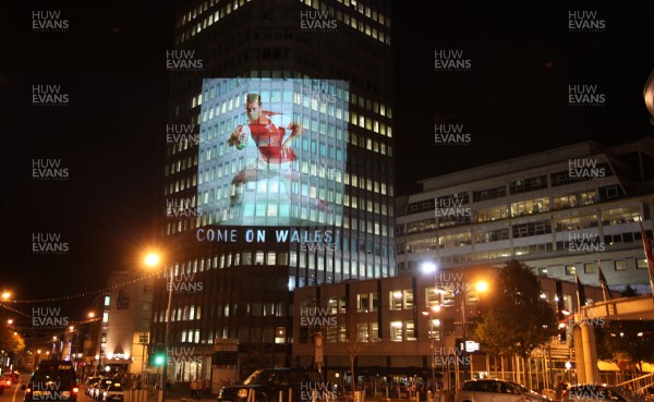 14.10.11 -  Good luck messages are projected onto the side Admiral's offices in Cardiff ahead of Wales' Rugby World Cup Semi Final against France 