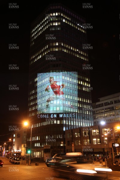 14.10.11 -  Good luck messages are projected onto the side Admiral's offices in Cardiff ahead of Wales' Rugby World Cup Semi Final against France 