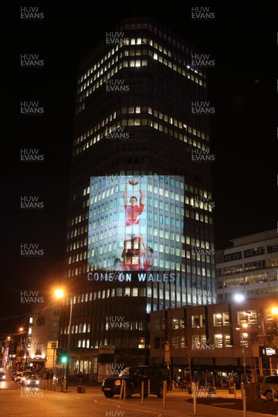14.10.11 -  Good luck messages are projected onto the side Admiral's offices in Cardiff ahead of Wales' Rugby World Cup Semi Final against France 