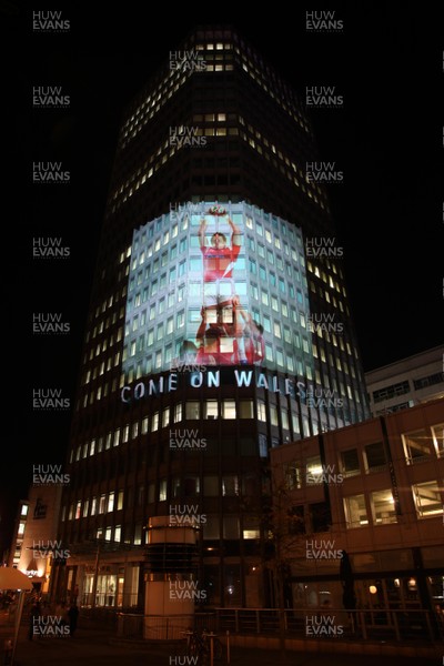 14.10.11 -  Good luck messages are projected onto the side Admiral's offices in Cardiff ahead of Wales' Rugby World Cup Semi Final against France 