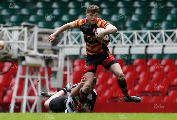 230416 - WRU - Plate Final - Gowerton Youth v Brynmawr Youth - Ethan Phillips of Brynmawr is tackled by Kieran Fisher of Gowerton