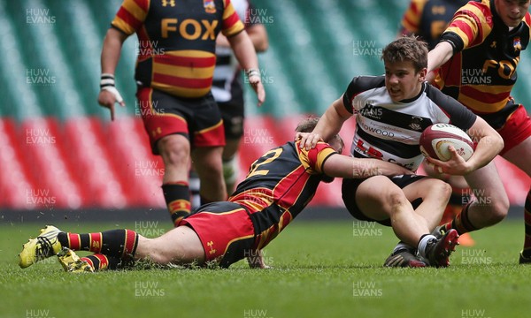 230416 - WRU - Plate Final - Gowerton Youth v Brynmawr Youth - Tom Ham of Gowerton is tackled by Oliver Richards of Brynmawr