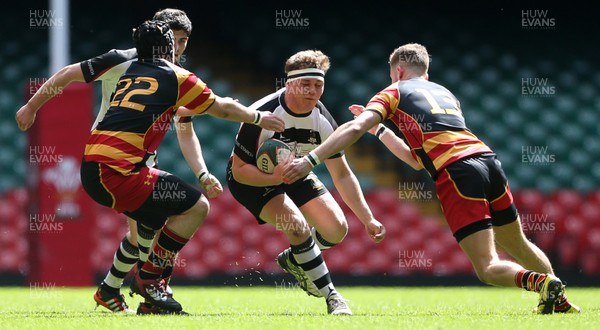 230416 - WRU - Plate Final - Gowerton Youth v Brynmawr Youth - Richard Keefe of Gowerton is tackled by Cory Lewis and Matthew Cross of Brynmawr