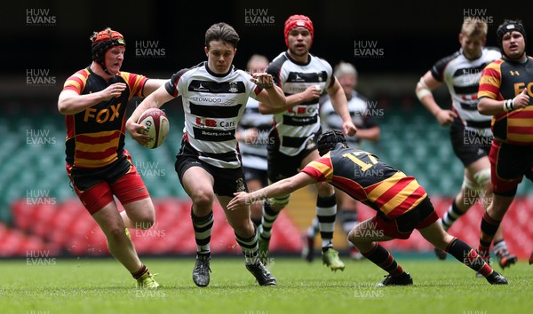 230416 - WRU - Plate Final - Gowerton Youth v Brynmawr Youth - Callum Carsen of Gowerton is tackled by Ellis Price and Matthew Jarrett of Brynmawr