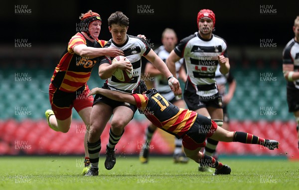 230416 - WRU - Plate Final - Gowerton Youth v Brynmawr Youth - Callum Carsen of Gowerton is tackled by Ellis Price and Matthew Jarrett of Brynmawr