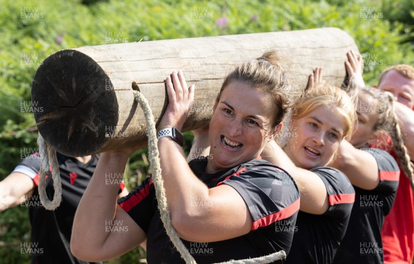 150722 - Wales Women’s rugby squad training session at The Green Mile, Cardiff - Siwan Lillicrap completes the log lift with team mates on the Green Mile course in the woods near Cardiff 