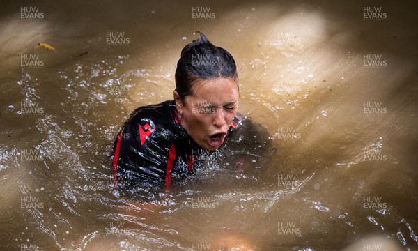 150722 - Wales Women’s rugby squad training session at The Green Mile, Cardiff - Sioned Harries takes on the submersion pool in the woods