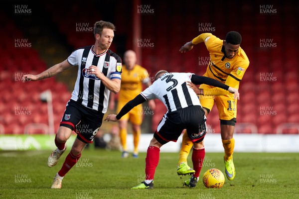 020219 - Grimsby Town v Newport County - Sky Bet League 2  Jamille Matt is is challenged by Grimsby's Sebastian Ring
