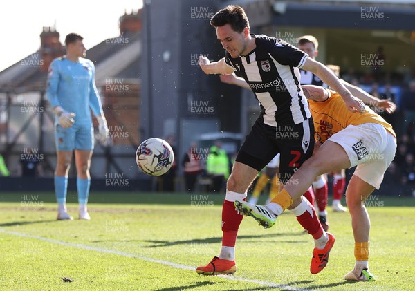 060424 - Grimsby Town v Newport County - Sky Bet League 2 - Adam Lewis of Newport County tries to wrest the ball from Liam Smith of Grimsby Town