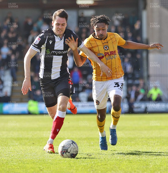 060424 - Grimsby Town v Newport County - Sky Bet League 2 - Matty Bondswell of Newport County and Liam Smith of Grimsby Town vie for the ball
