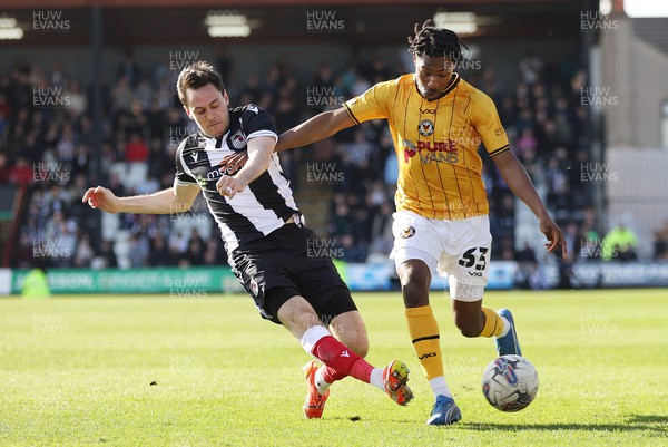 060424 - Grimsby Town v Newport County - Sky Bet League 2 - Matty Bondswell of Newport County and Liam Smith of Grimsby Town vie for the ball
