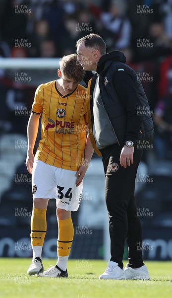 060424 - Grimsby Town v Newport County - Sky Bet League 2 - Manager Graham Coughlan of Newport County comforts Jack Norris at the end of the match