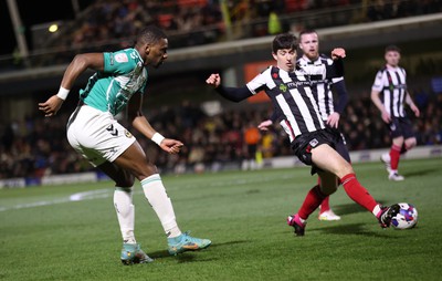 070323 - Grimsby Town v Newport County - Sky Bet League 2 - Omar Bogle of Newport County tries a shot on goal but blocked by Anthony Glennon of Grimsby Town