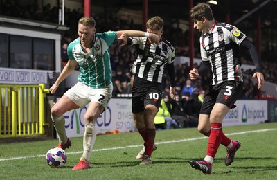 070323 - Grimsby Town v Newport County - Sky Bet League 2 - John McAtee of Grimsby Town and Anthony Glennon of Grimsby Town gang up on Hayden Lindley of Newport County