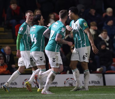 070323 - Grimsby Town v Newport County - Sky Bet League 2 - Priestley Farquharson of Newport County celebrates his goal with Aaron Lewis of Newport County and Matt Baker of Newport County