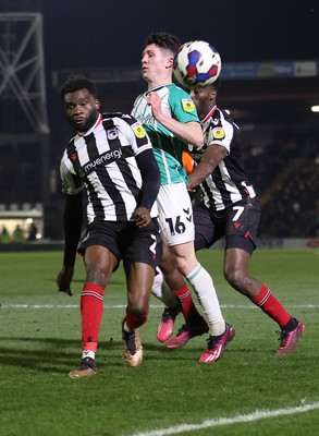 070323 - Grimsby Town v Newport County - Sky Bet League 2 - Calum Kavanagh of Newport County tries a shot on goal followed by Josh Emmanuel of Grimsby Town and Lichee Efete of Grimsby Town