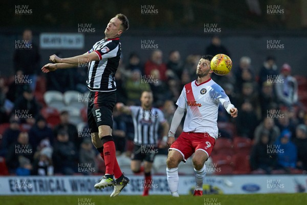 130118 - Grimsby Town v Newport County - Sky Bet League Two -  Grimsby's Nathan Clarke beats Newport's Padraig Amond