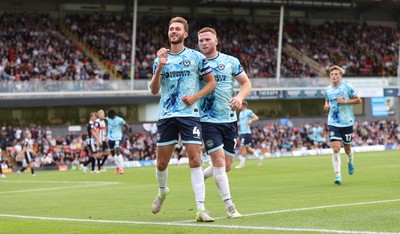 160825 - Grimsby Town v Newport County - Sky Bet League 2 - Matt Baker of Newport celebrates after scoring equaliser with Lee Jenkins of Newport