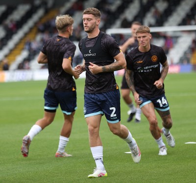 160825 - Grimsby Town v Newport County - Sky Bet League 2 - Warm up Cameron Evans of Newport and Kai Whitmore of Newport