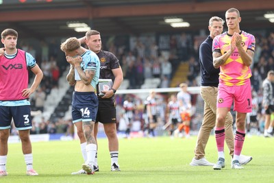 160825 - Grimsby Town v Newport County - Sky Bet League 2 - Team applaud travelling fans at the end of the match with Kai Whitmore of Newport visibly upset