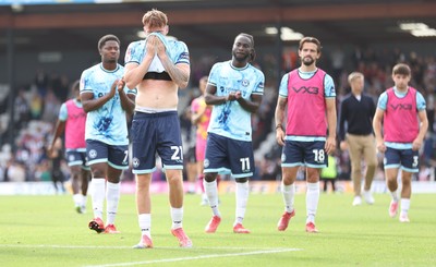 160825 - Grimsby Town v Newport County - Sky Bet League 2 - Team applaud travelling fans at the end of the match with Michael Spellman of Newport visibly upset