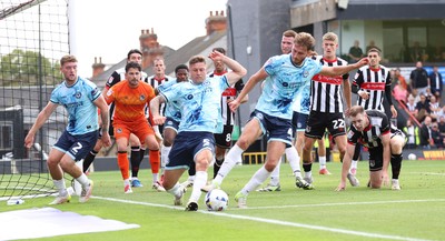 160825 - Grimsby Town v Newport County - Sky Bet League 2 - scramble in goalmouth with James Clarke of Newport and Cameron Evans of Newport and Matt Baker of Newport