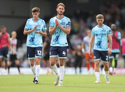 160825 - Grimsby Town v Newport County - Sky Bet League 2 - Matt Baker of Newport and Cameron Evans of Newport and Joe Thomas of Newport applaud the fans at the end of the match