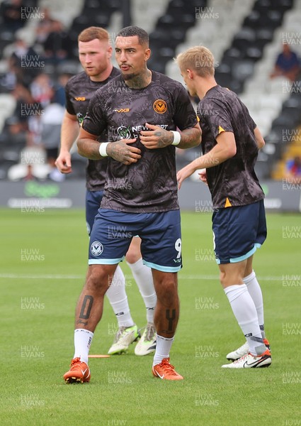 160825 - Grimsby Town v Newport County - Sky Bet League 2 - Courtney Baker-Richardson of Newport and Lee Jenkins of Newport and Matthew Smith of Newport warm up before the match
