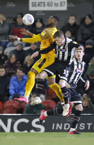 250220 - Grimsby Town v Newport County - Sky Bet League 2 - Jamille Matt of Newport County and Harry Clifton of Grimsby Town