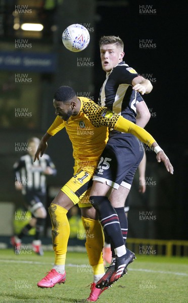 250220 - Grimsby Town v Newport County - Sky Bet League 2 - Jamille Matt of Newport County and Mattie Pollock of Grimsby Town