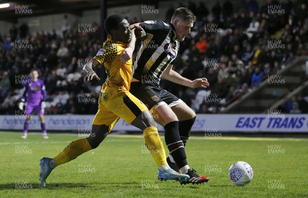 250220 - Grimsby Town v Newport County - Sky Bet League 2 - Jordan Green of Newport County and Mattie Pollock of Grimsby Town