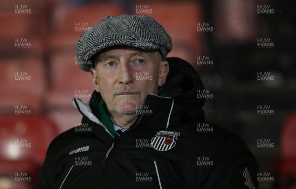 250220 - Grimsby Town v Newport County - Sky Bet League 2 - Manager Ian Holloway of Grimsby Town sits in the dugout before the match