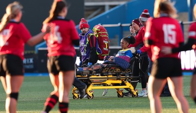 271225 - Gwalia Lightning v Brython Thunder, Celtic Challenge - Nia Fajeyisan of Gwalia Lightning is treated after being injured before leaving the pitch on a stretcher 