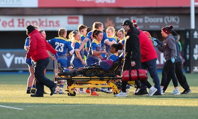 271225 - Gwalia Lightning v Brython Thunder, Celtic Challenge - Nia Fajeyisan of Gwalia Lightning is treated after being injured before leaving the pitch on a stretcher 
