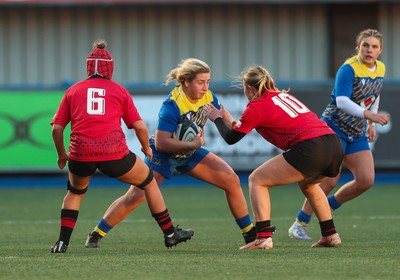 271225 - Gwalia Lightning v Brython Thunder, Celtic Challenge - Molly Reardon of Gwalia Lightning takes on Ffion Williams of Brython Thunder and Finley Jones of Brython Thunder