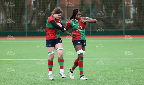 140226 - Gwalia Lightning v Clovers, Celtic Challenge - Jemima Adams Verling of Clovers and Faith Oviawe of Clovers at the end of the match